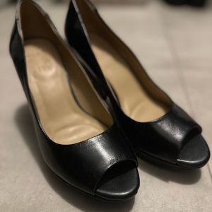 Black leather pumps